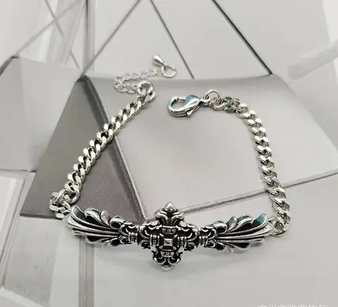 Silver Chain Bracelet with Ornate Wing Design