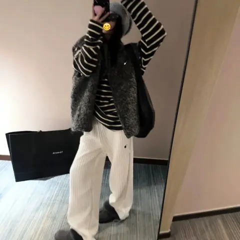 Striped Sweater with Faux Fur Vest and Wide-Leg Pants Outfit
