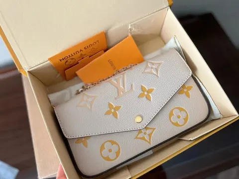 Louis Vuitton Monogram White Wallet with Gold Accents