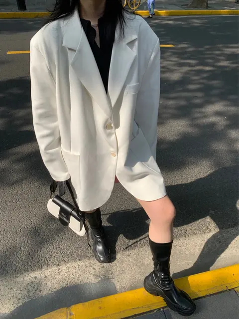 White Oversized Blazer with Black Boots and Crossbody Bag