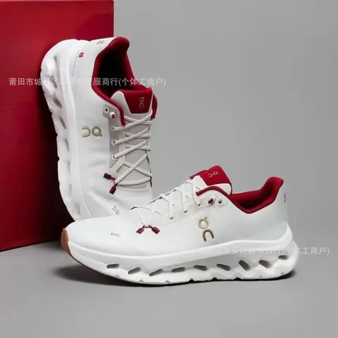 On Cloud running shoes white with red accents