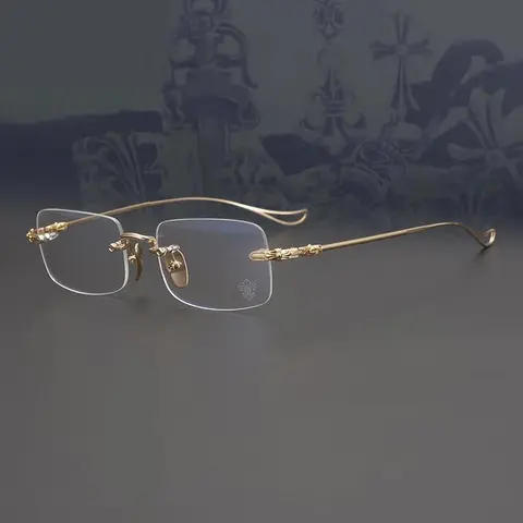 Gold Rimless Eyeglasses with Fleur-de-Lis Detail