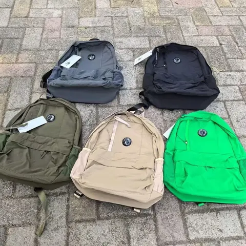 Collection of Five Colorful Backpacks with Circular Logo
