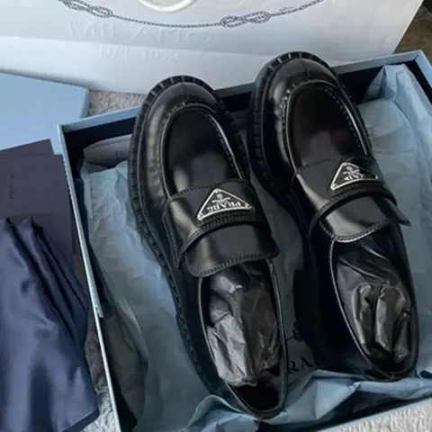 Prada Black Leather Loafers with Logo Strap