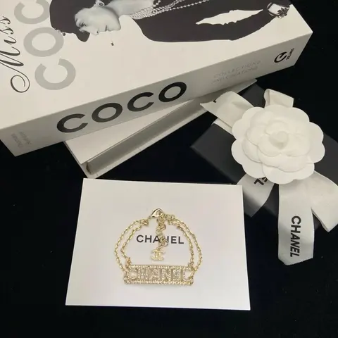 Chanel Gold Tone Logo Bracelet with Crystal Detail