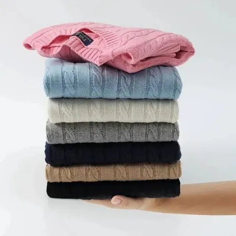 Stack of Cable Knit Sweaters in Assorted Colors