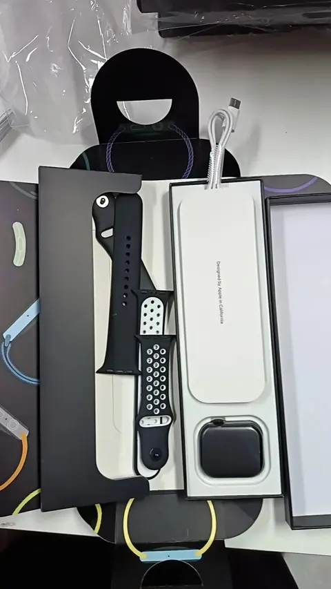 Apple Watch with Black Sport Band and Charging Cable