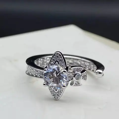 Silver Diamond Ring with Arrowhead Design and Side Cross Detail