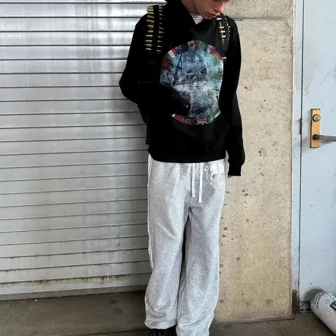 Black Graphic Hoodie with Colorful Circular Print and Gray Track Pants