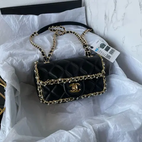 Chanel Black Quilted Leather Shoulder Bag with Gold Hardware and Pearl Chain