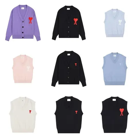 Comme des Garçons Heart Logo Cardigans and Sweater Vests
