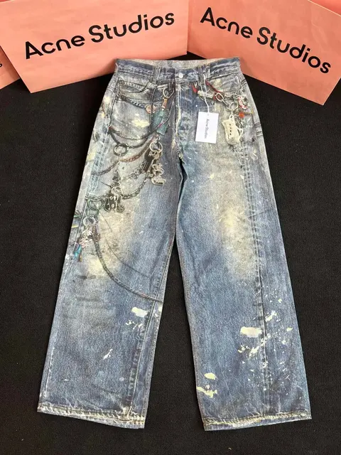 Acne Studios Distressed Wide-Leg Jeans with Chain Details