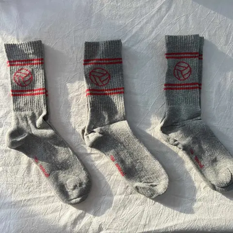 Three Pairs of Gray Athletic Socks with Red Logo