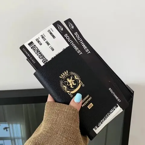 Black Leather Passport Wallet with Gold Crest Design
