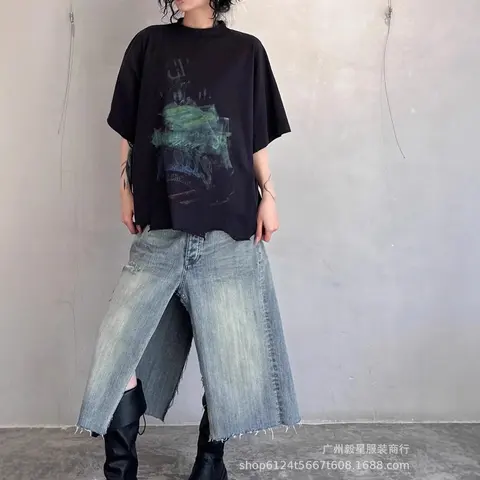 Black Oversized Graphic T-Shirt with Distressed Denim Skirt