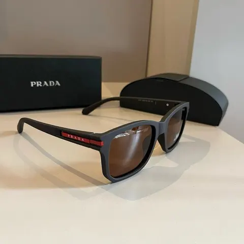 Prada Black Sunglasses with Red Logo Detail