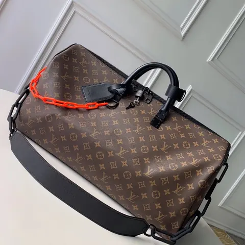 Louis Vuitton Monogram Keepall with Orange Chain Detail
