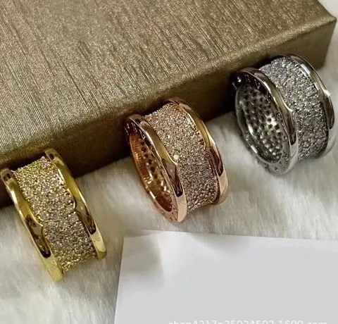 Lead-Free Rhinestone-Studded Spring Ring Set with Diamond Accents and Red Figure Design - Charity Couple Rings
